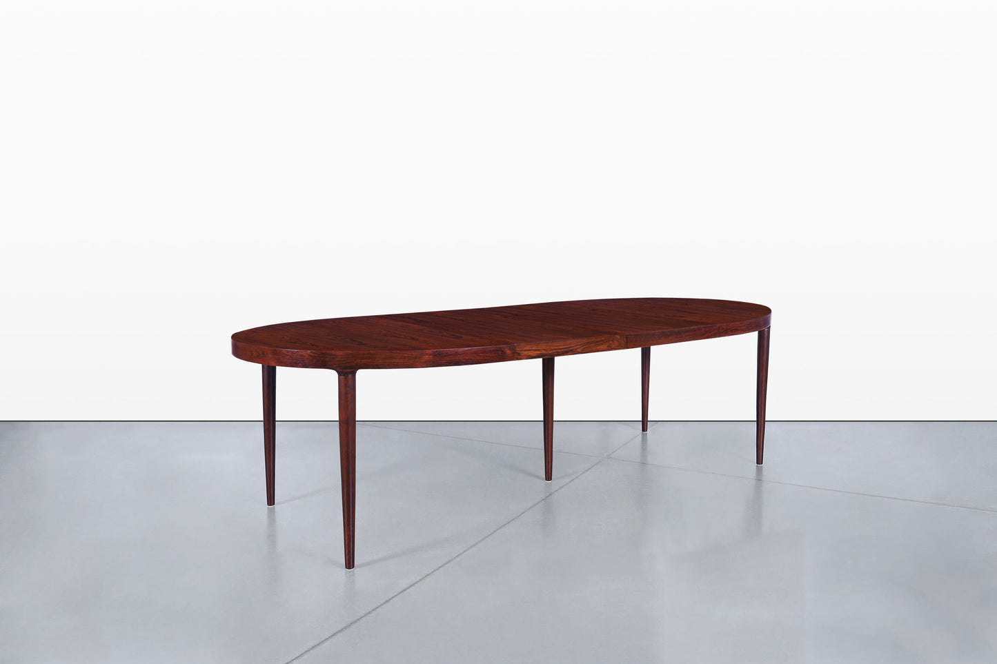 Danish Modern Expanding Rosewood Dining Table by Harry Ostergaard