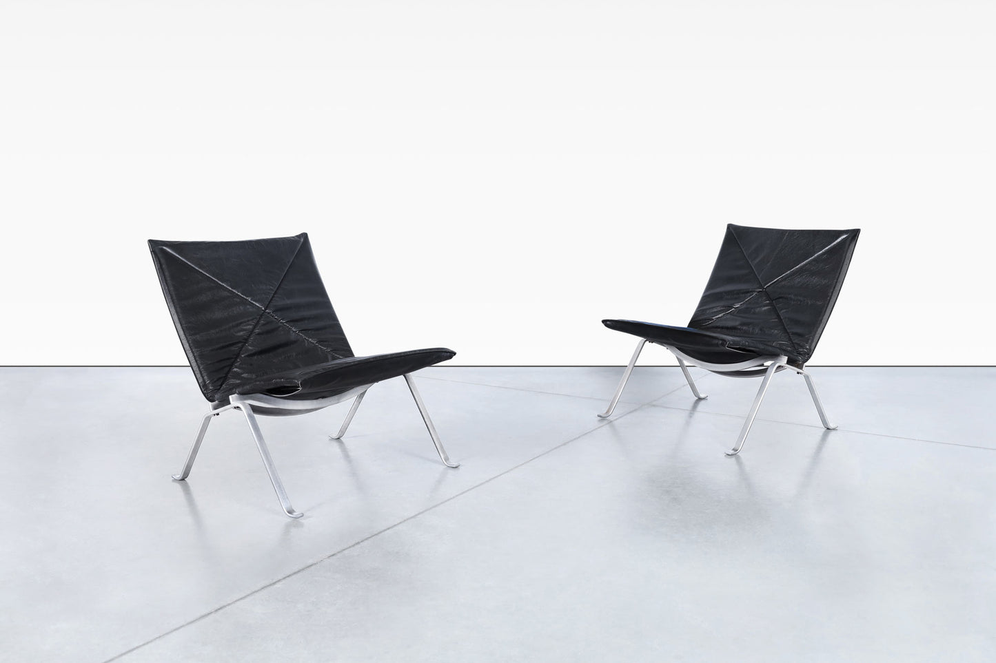 Early Leather PK22 Lounge Chairs by Poul Kjearholm for E. Kold Christensen