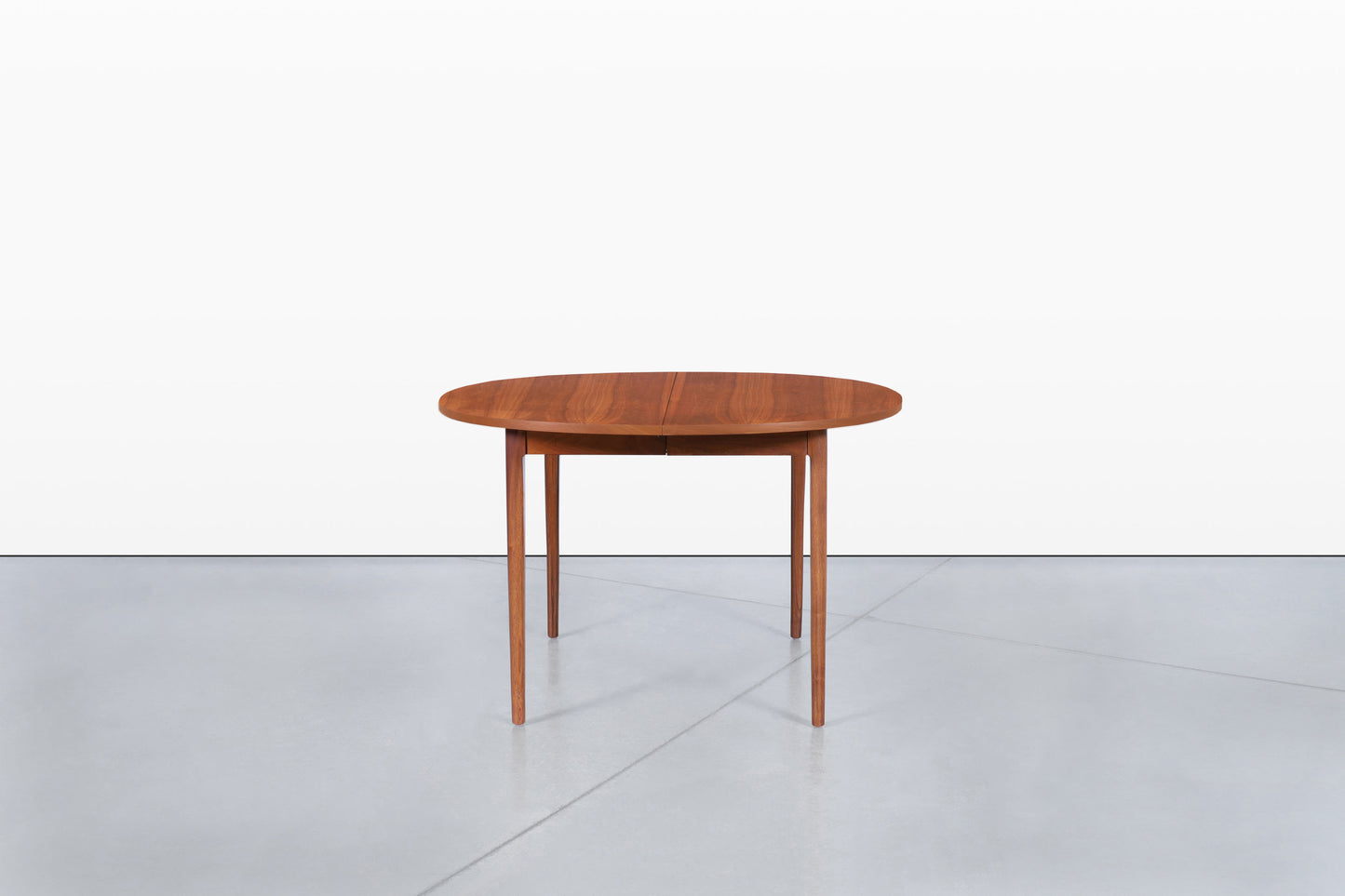 Mid-Century Extendable Round Walnut Dining Table by Kipp Stewart for Drexel