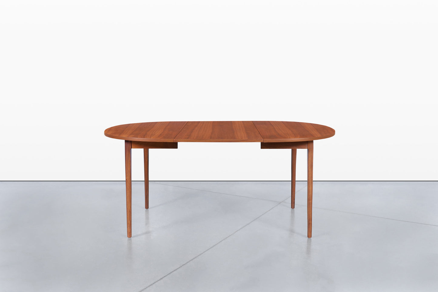 Mid-Century Extendable Round Walnut Dining Table by Kipp Stewart for Drexel