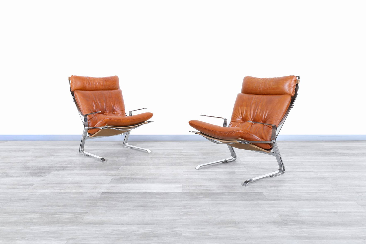 Mid-Century Leather and Chrome Lounge Chairs by Elsa and Nordahl Solheim
