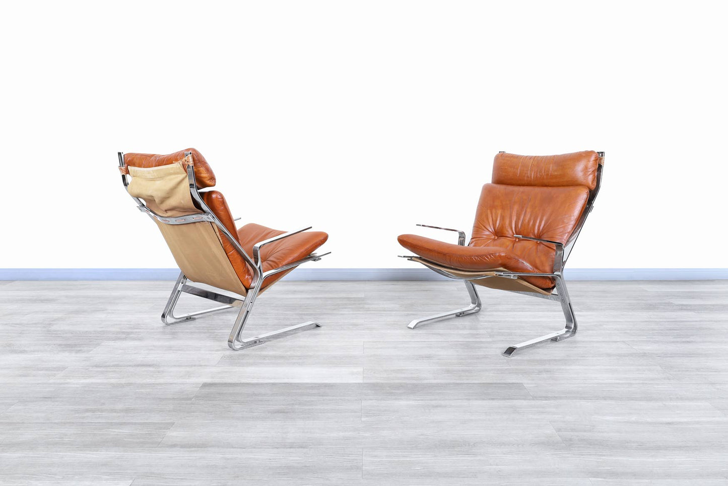 Mid-Century Leather and Chrome Lounge Chairs by Elsa and Nordahl Solheim