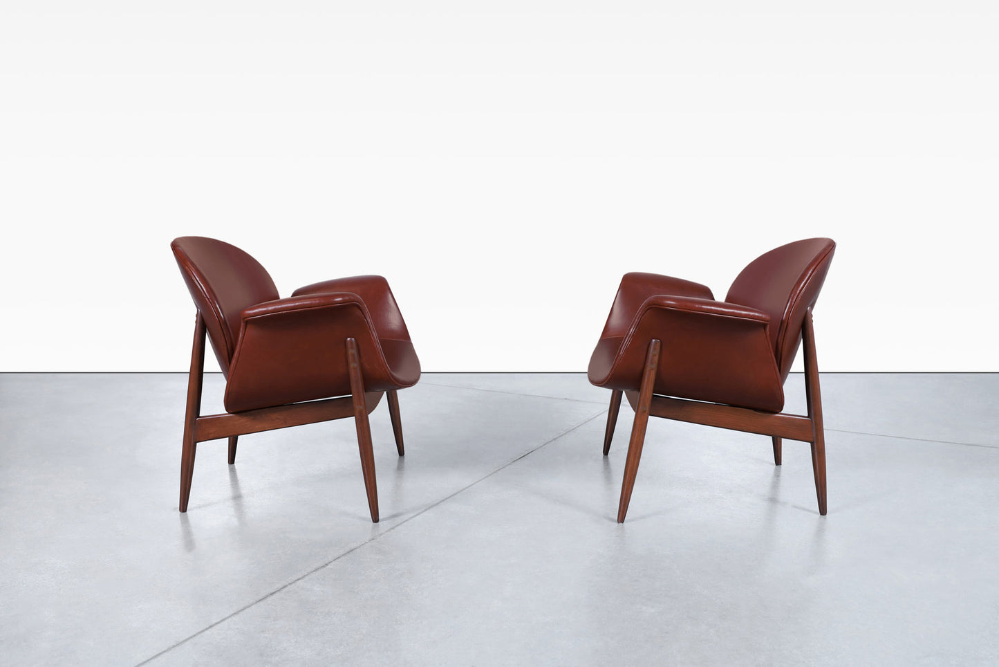 Vintage Leather and Walnut "Swan" Lounge Chairs by Arthur Umanoff
