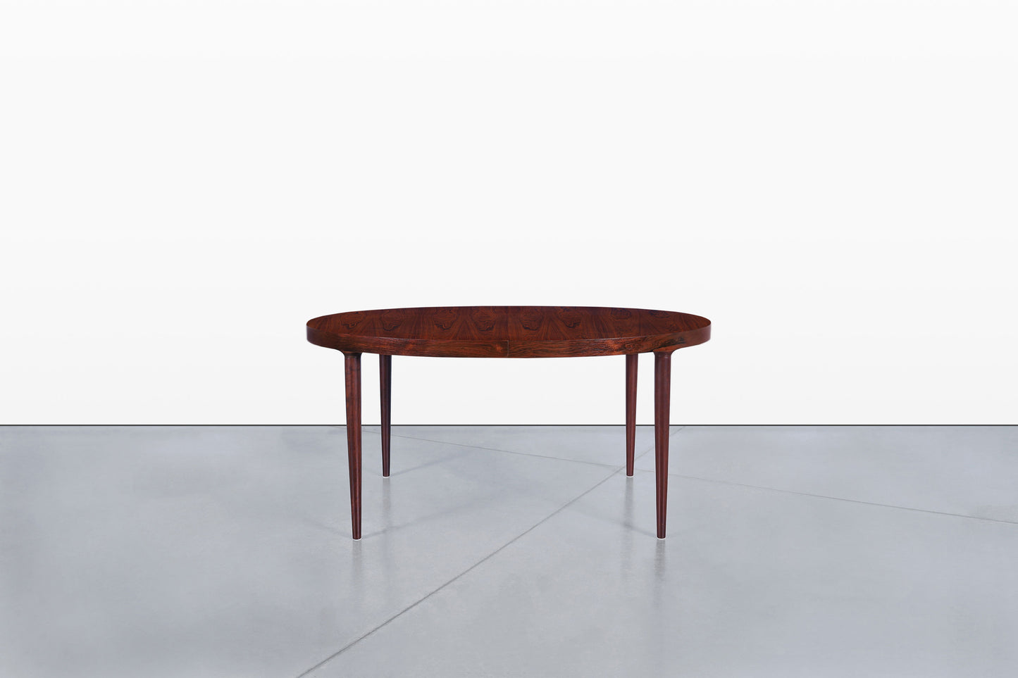 Danish Modern Expanding Rosewood Dining Table by Harry Ostergaard