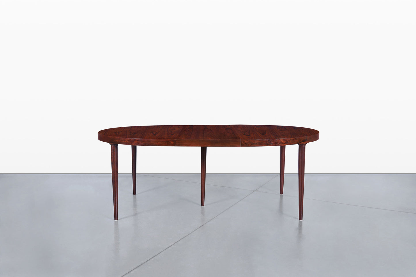 Danish Modern Expanding Rosewood Dining Table by Harry Ostergaard