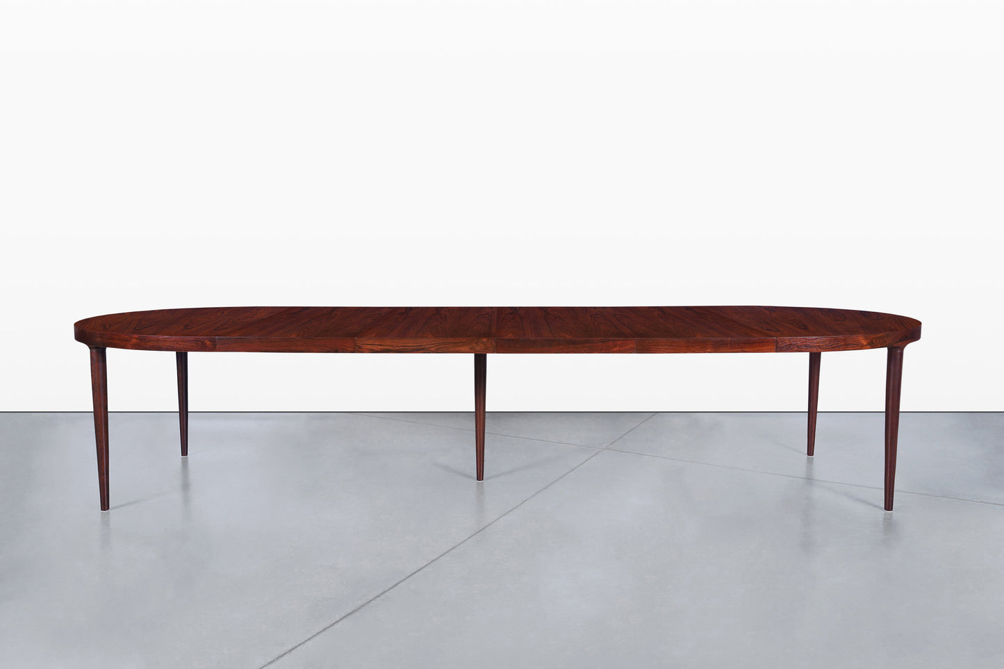 Danish Modern Expanding Rosewood Dining Table by Harry Ostergaard