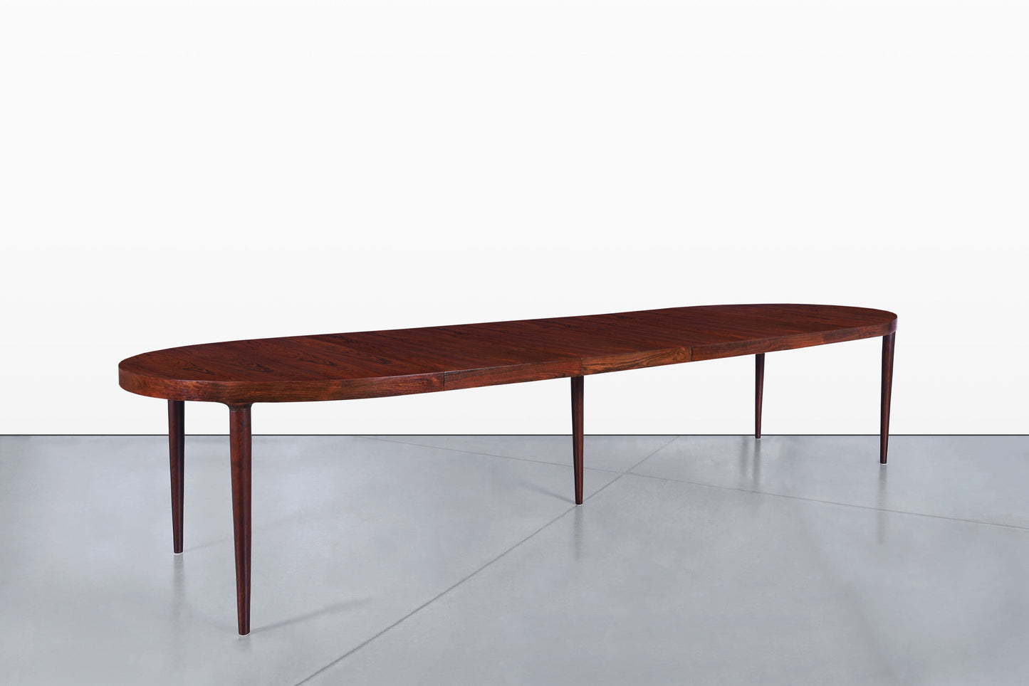 Danish Modern Expanding Rosewood Dining Table by Harry Ostergaard