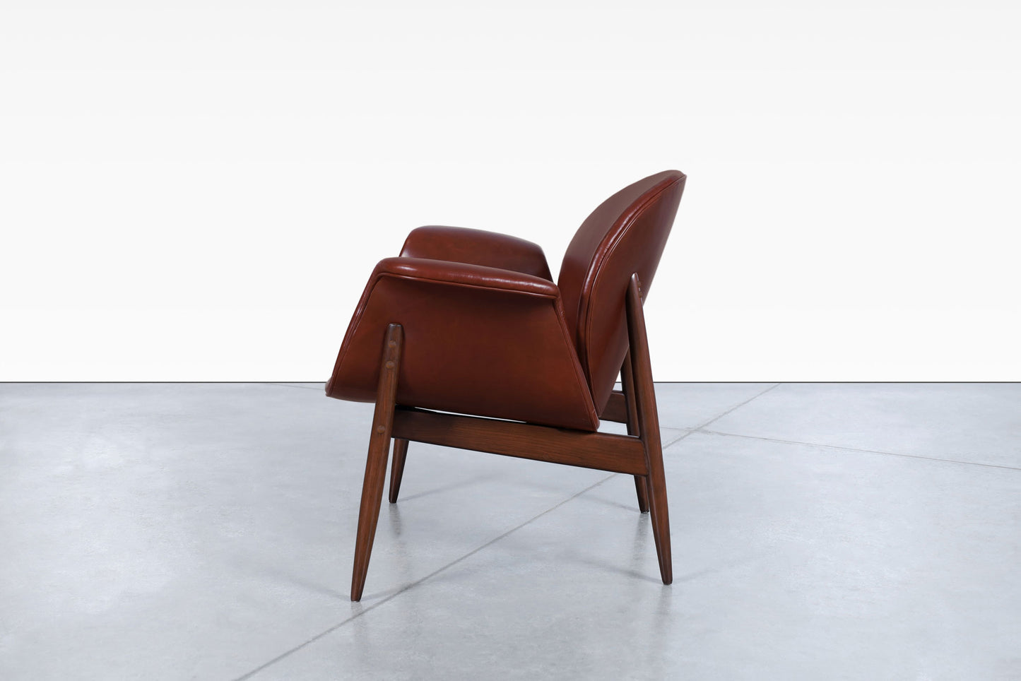 Vintage Leather and Walnut "Swan" Lounge Chairs by Arthur Umanoff